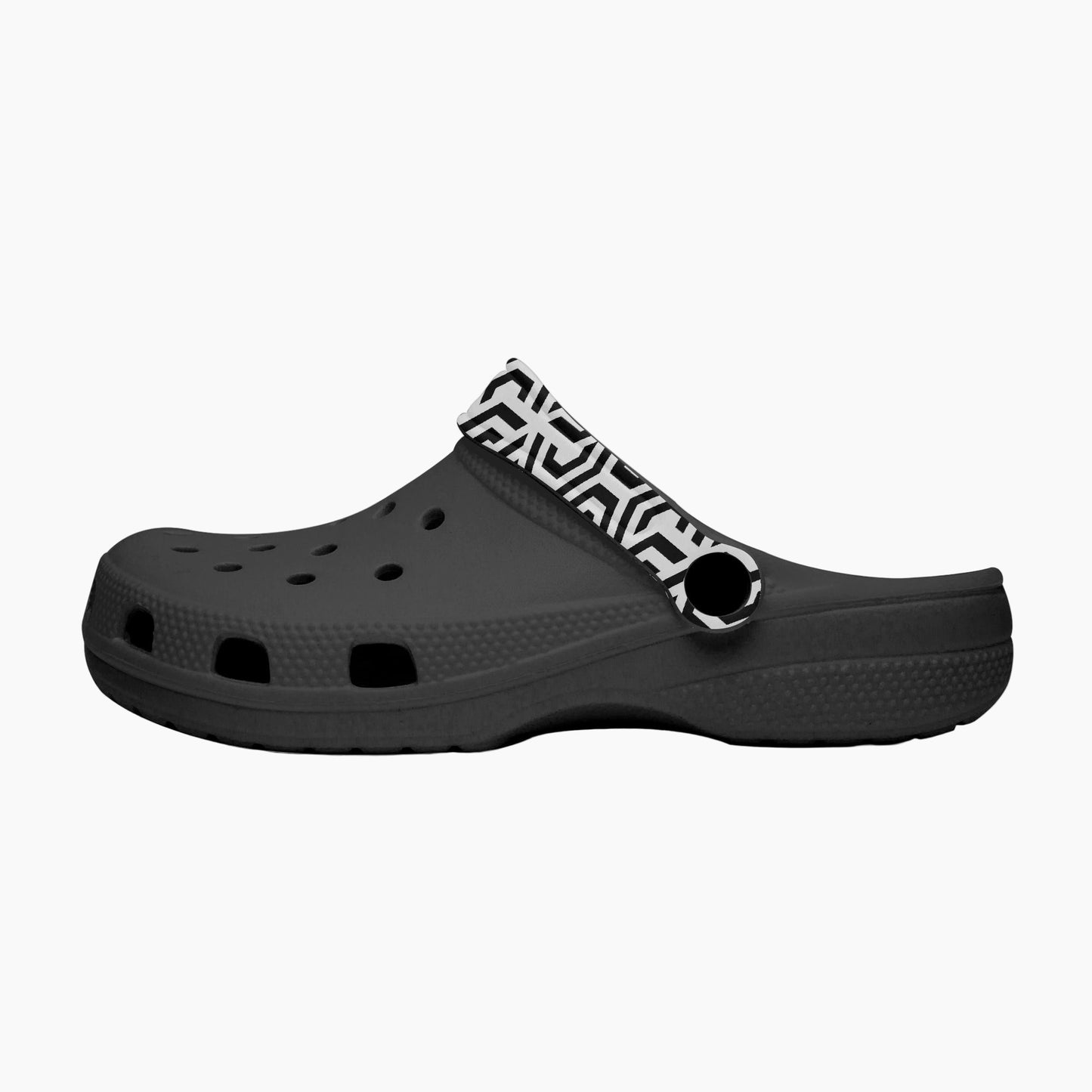 Black clog shoe with a patterned strap on a white background
