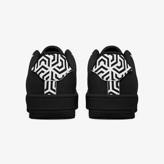 Black shoes with white geometric patterns on a white background