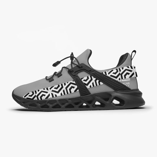 Gray and black sneaker with geometric pattern on a white background