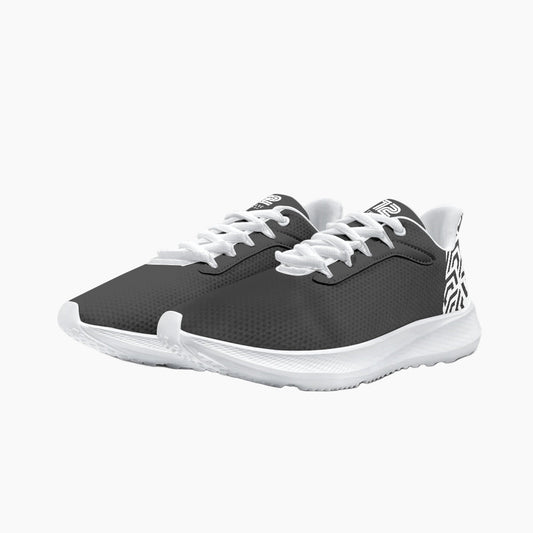 Pair of black and white athletic shoes on a white background