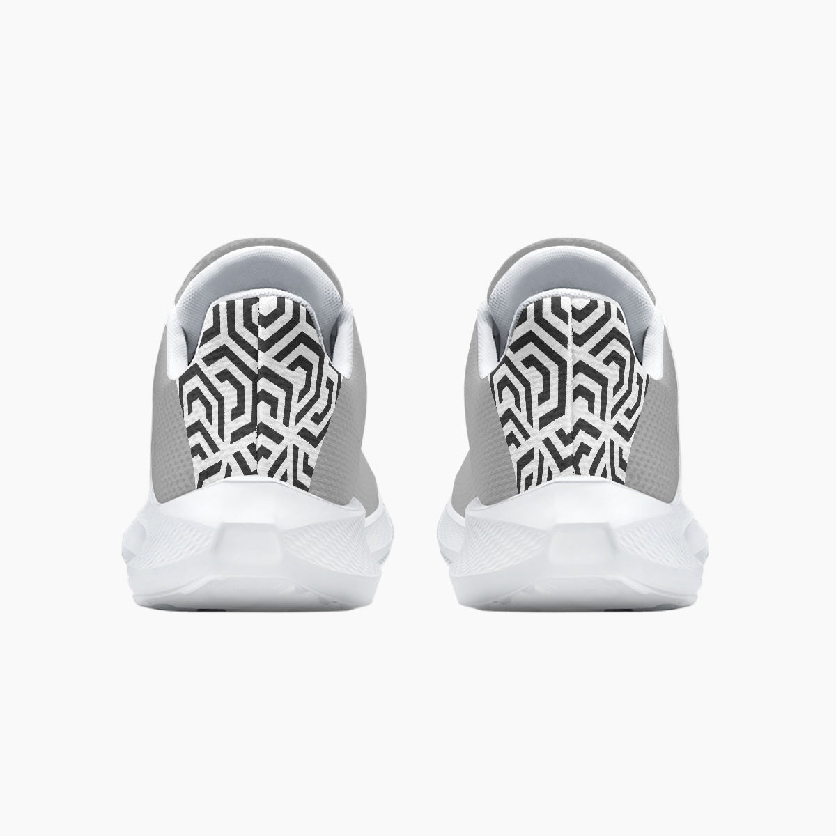 White sneakers with black geometric pattern on a white background