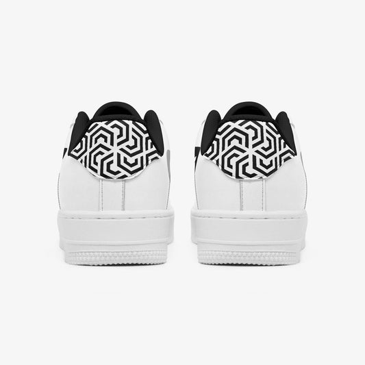 White sneakers with black and white patterned heel cups on a white background