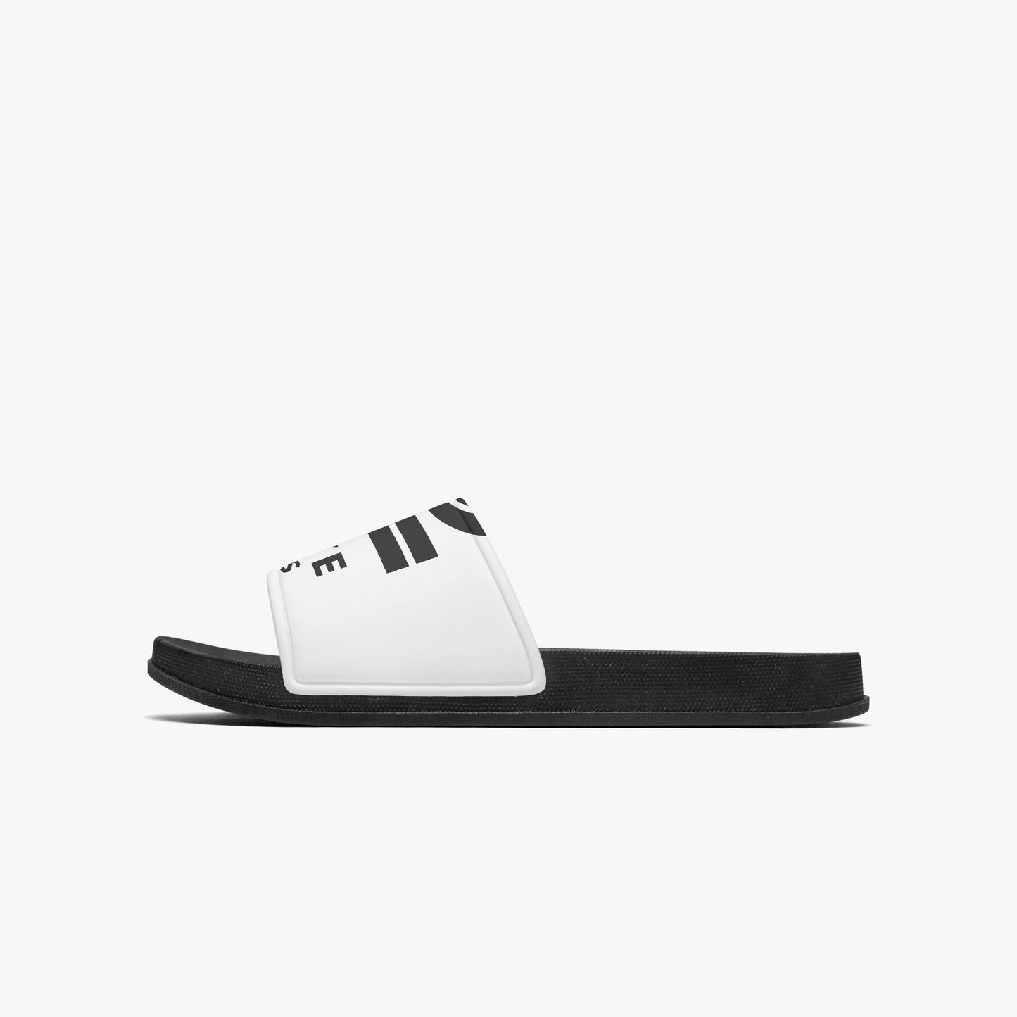 Black and white slide sandal on a light gray background