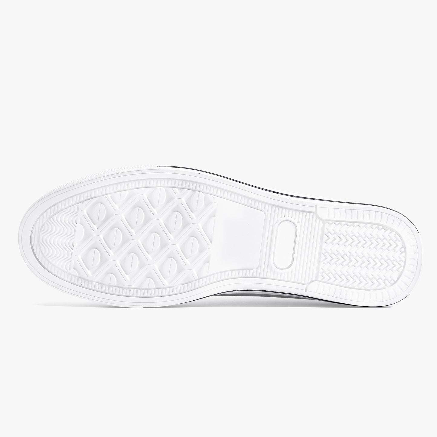 Close-up of a white sneaker sole with a textured pattern on a light gray background