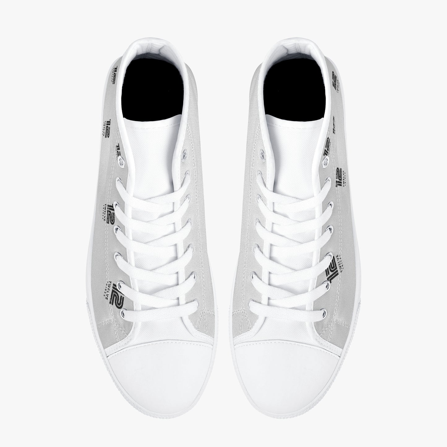 Pair of white high-top sneakers on a white background