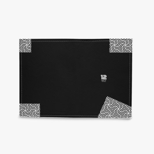 Black desk mat with geometric patterns and a logo on a white background