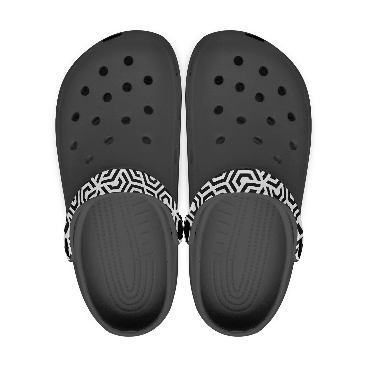 Black clogs with a white and black patterned strap on a white background