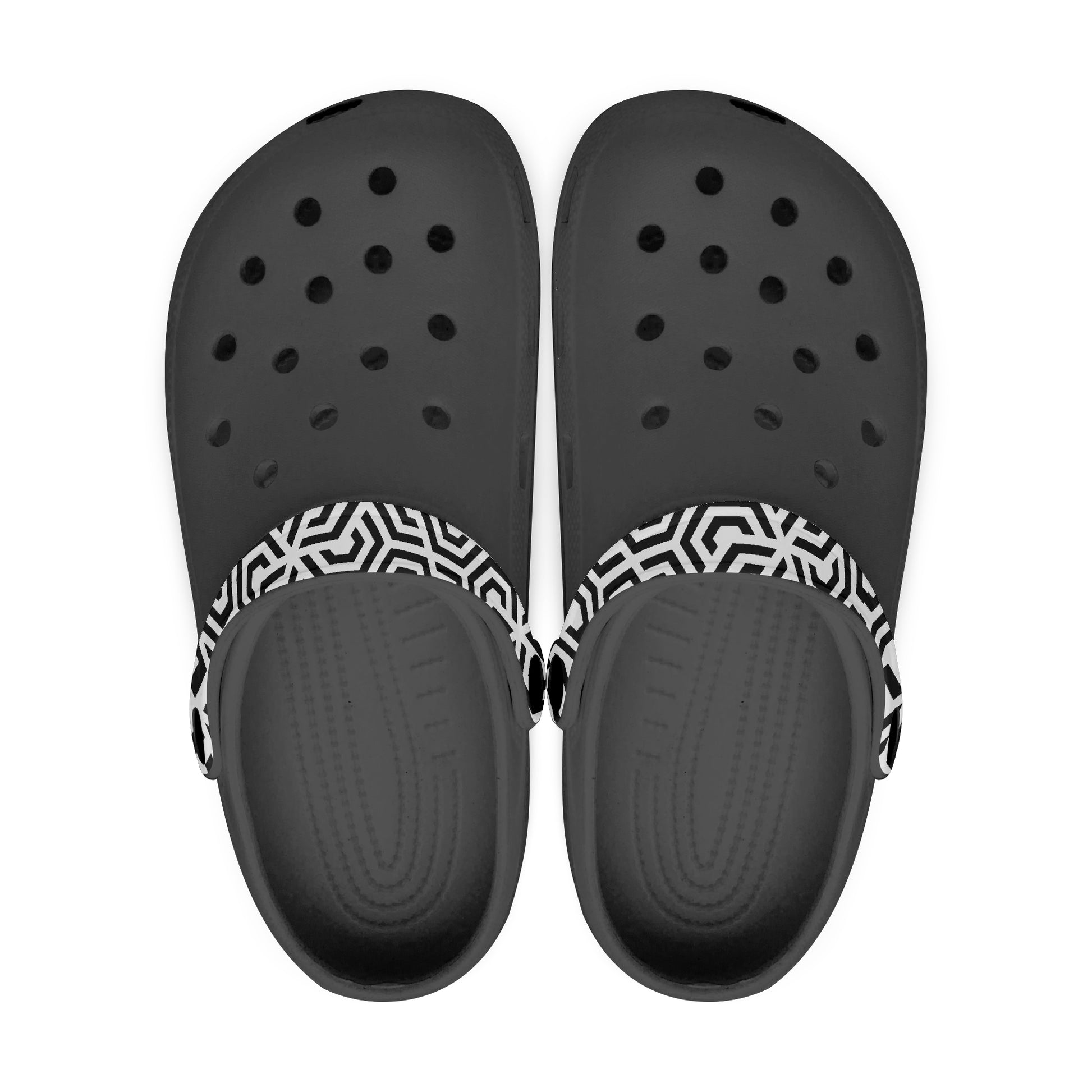 Black clogs with a white and black patterned strap on a white background