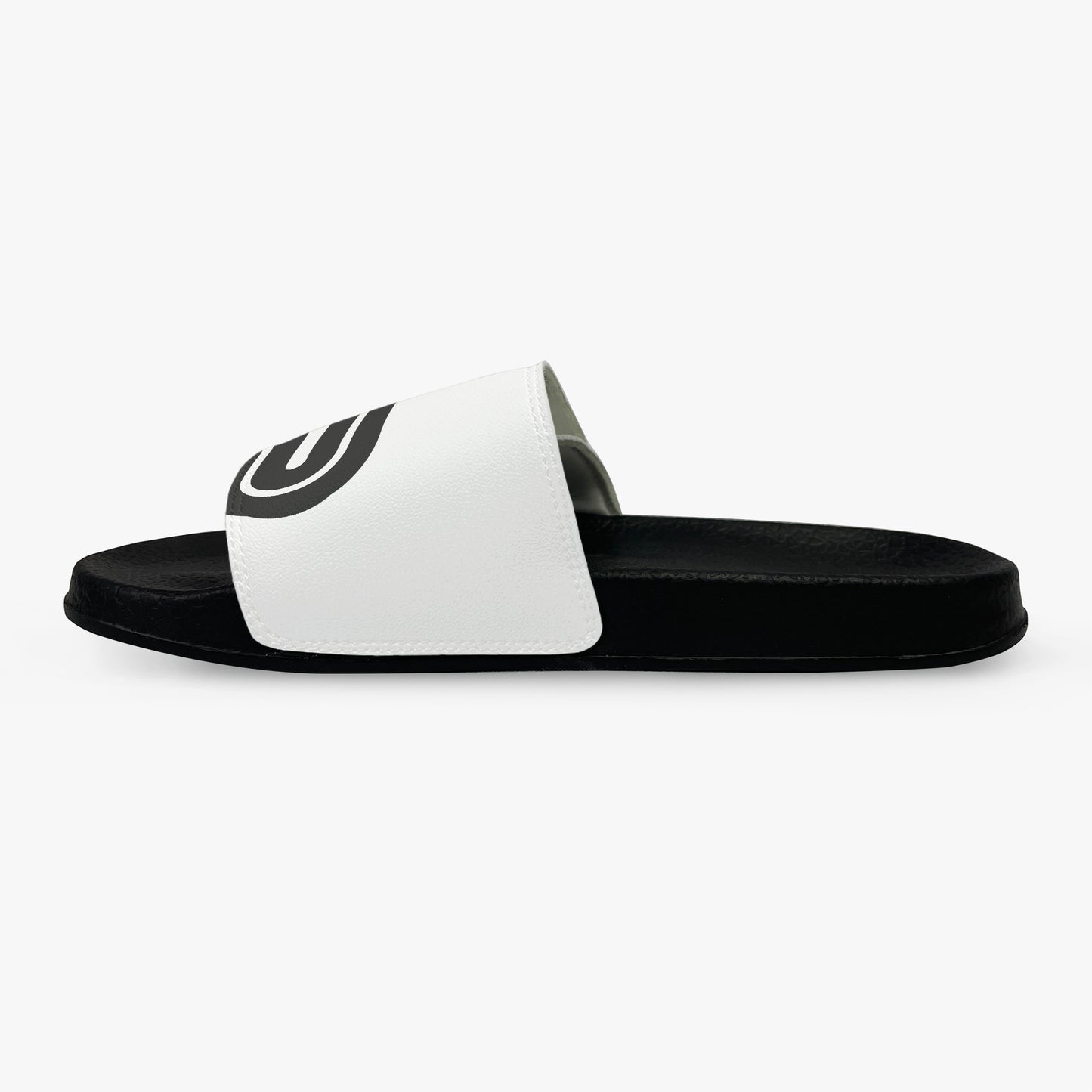 Black and white slide sandal with a logo on a white background