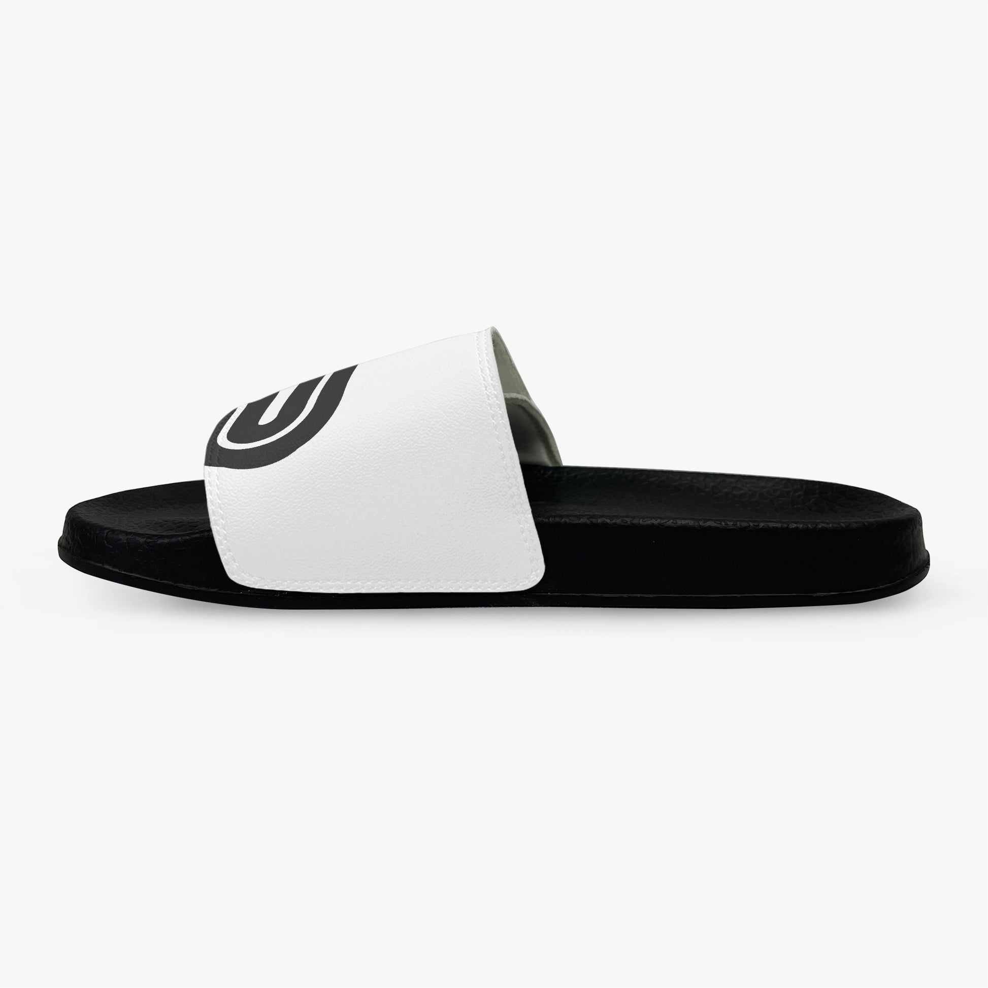 Black and white slide sandal with a logo on a white background