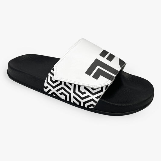 Black slide sandal with white strap featuring geometric pattern on a white background