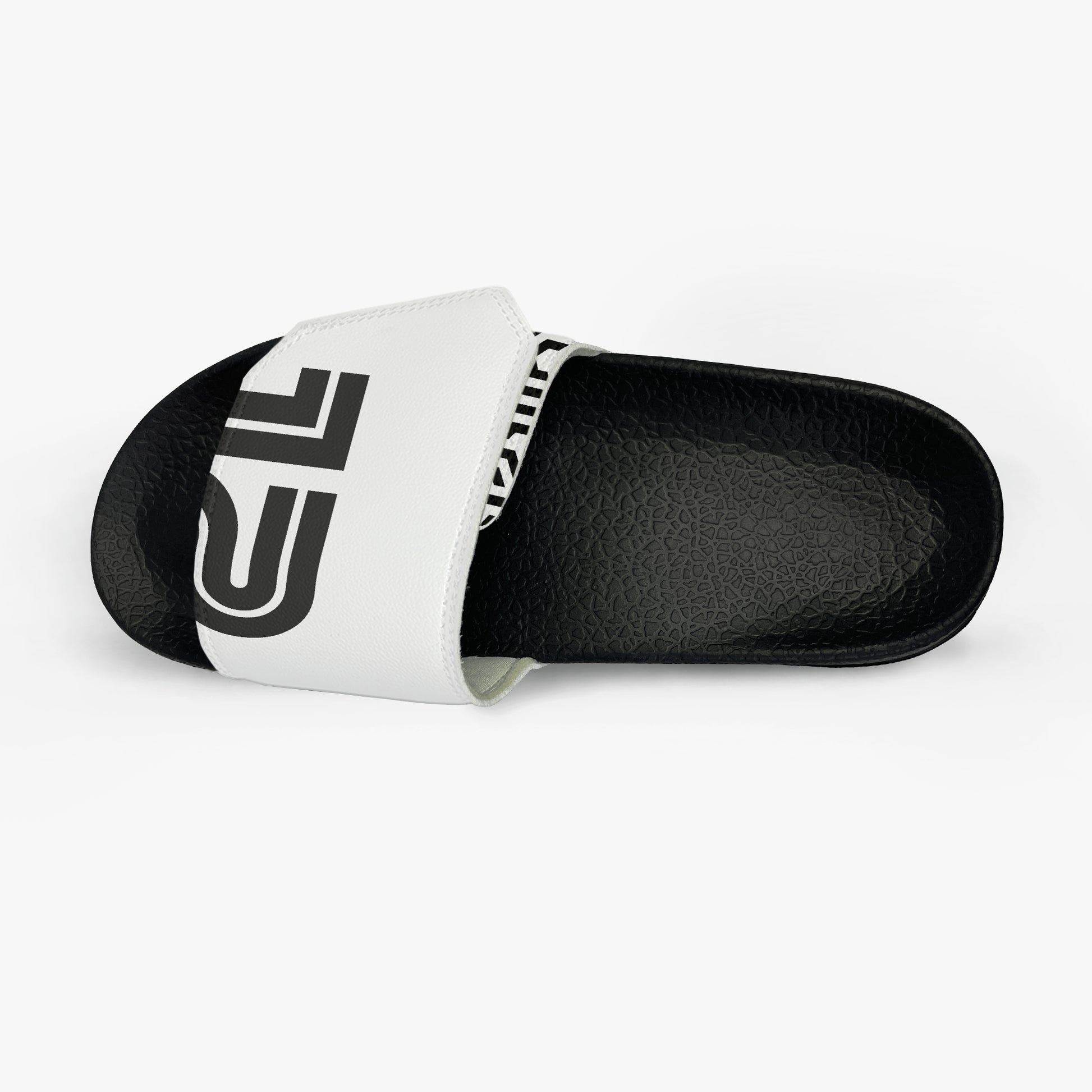 Black and white slide sandal with a logo on a white background