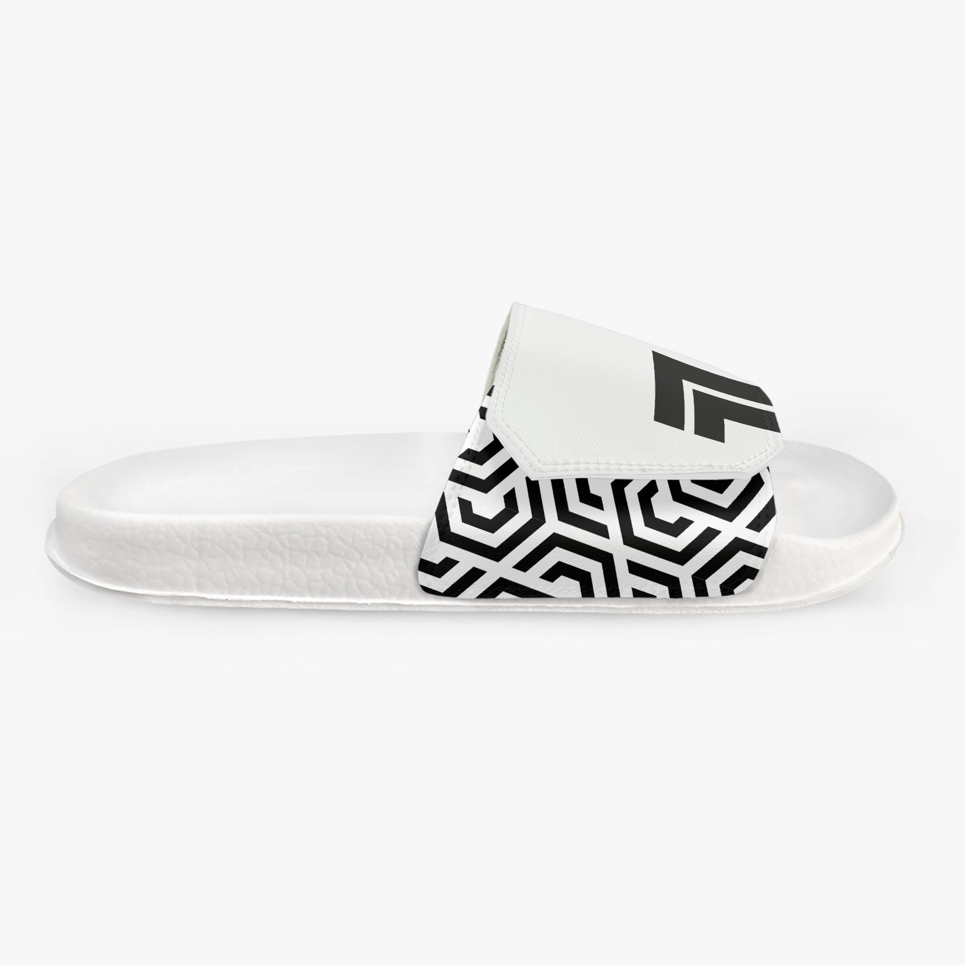 White slide sandal with black geometric pattern on a white background