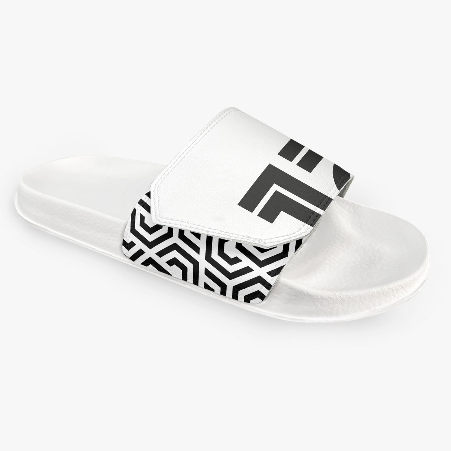 White slide sandal with black geometric pattern on a white background