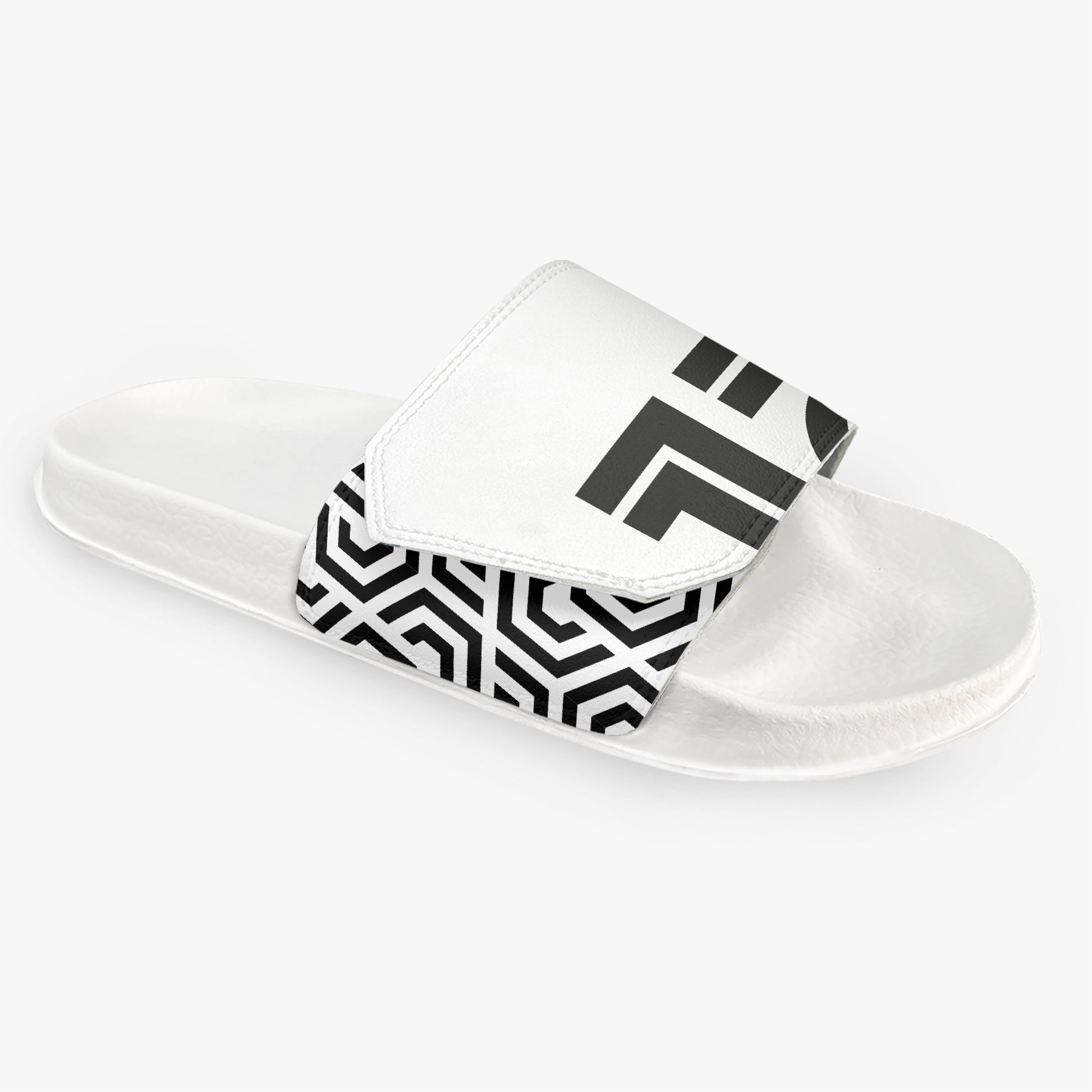White slide sandal with black geometric pattern on a white background