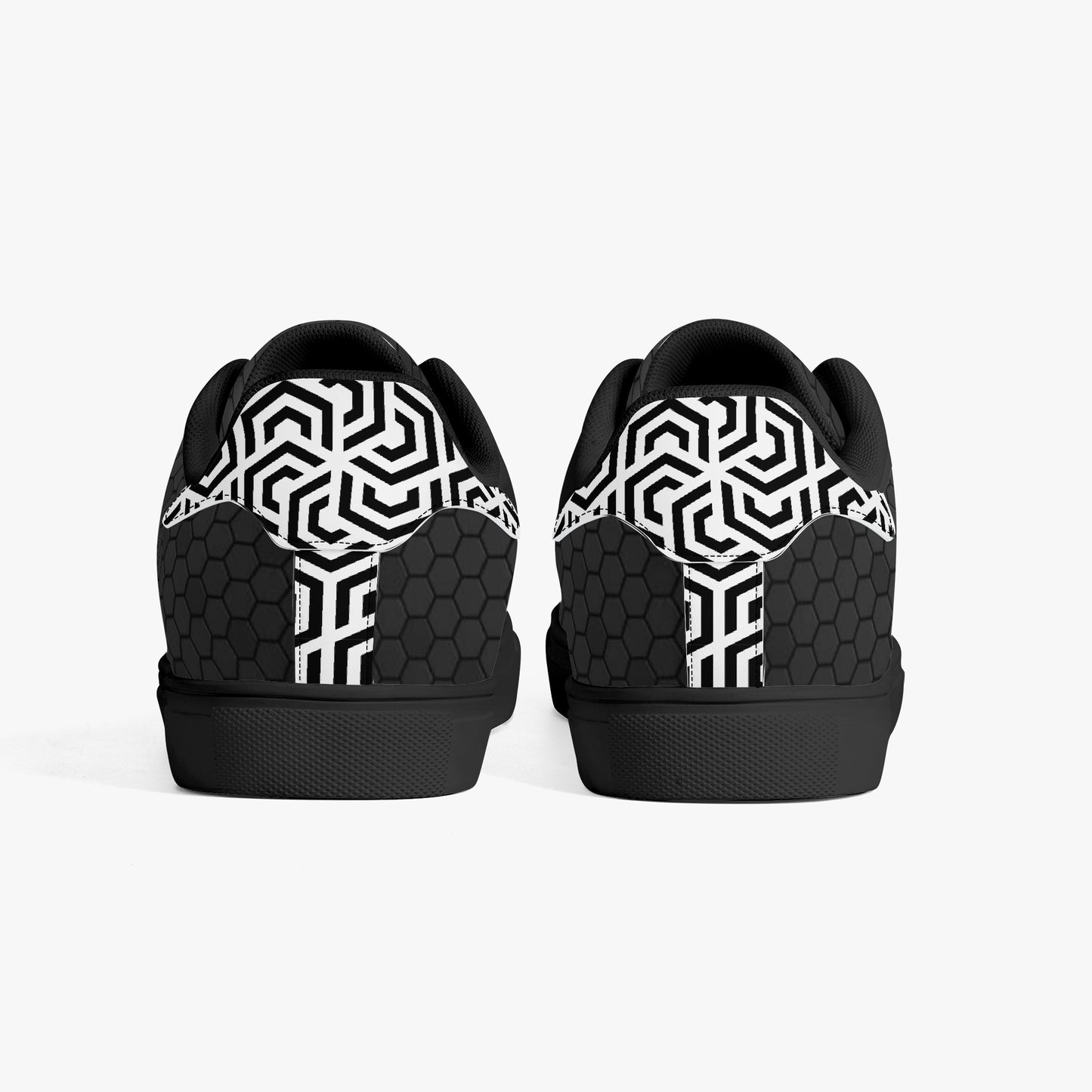 Black and white geometric patterned shoes on a white background