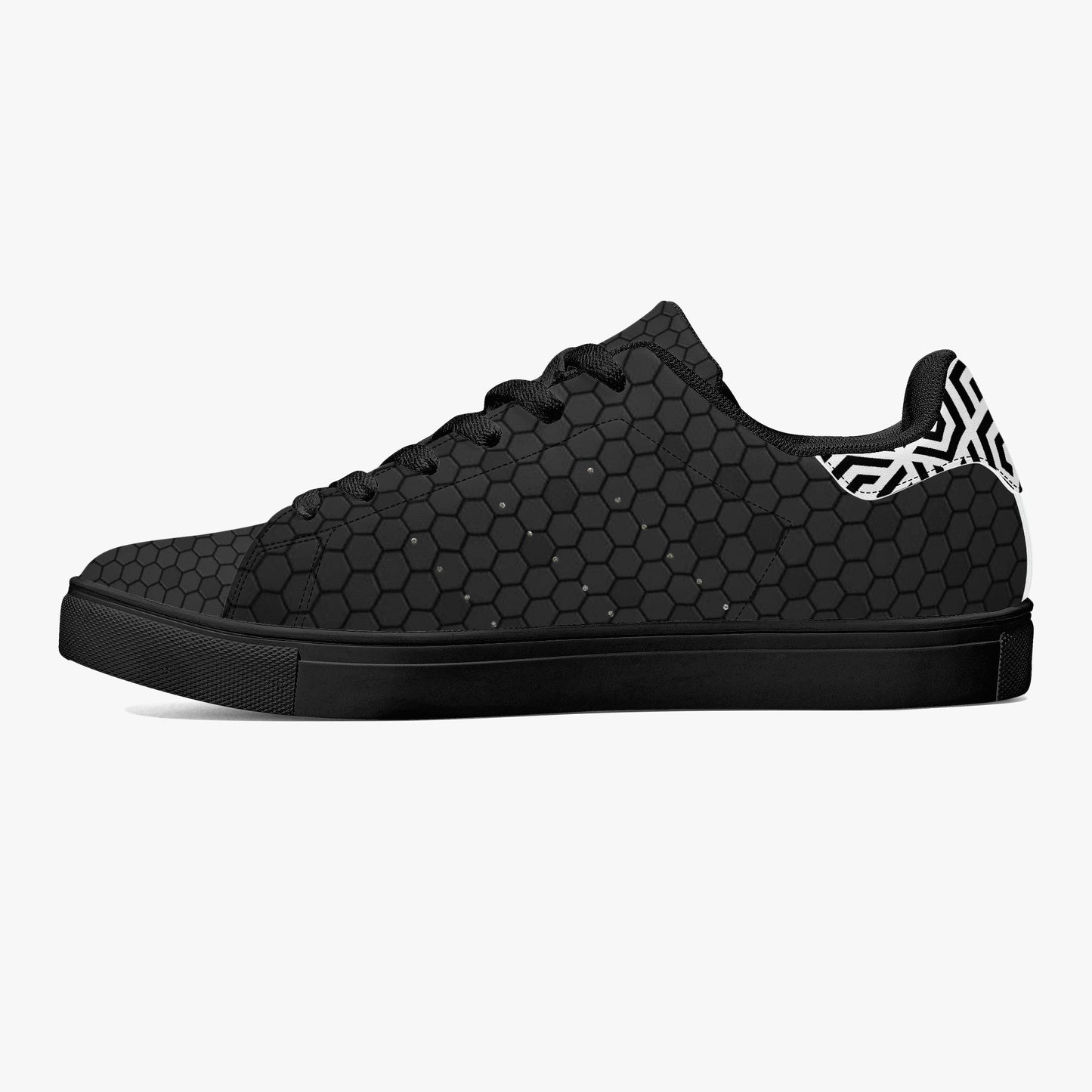 Black sneaker with a unique pattern on a white background