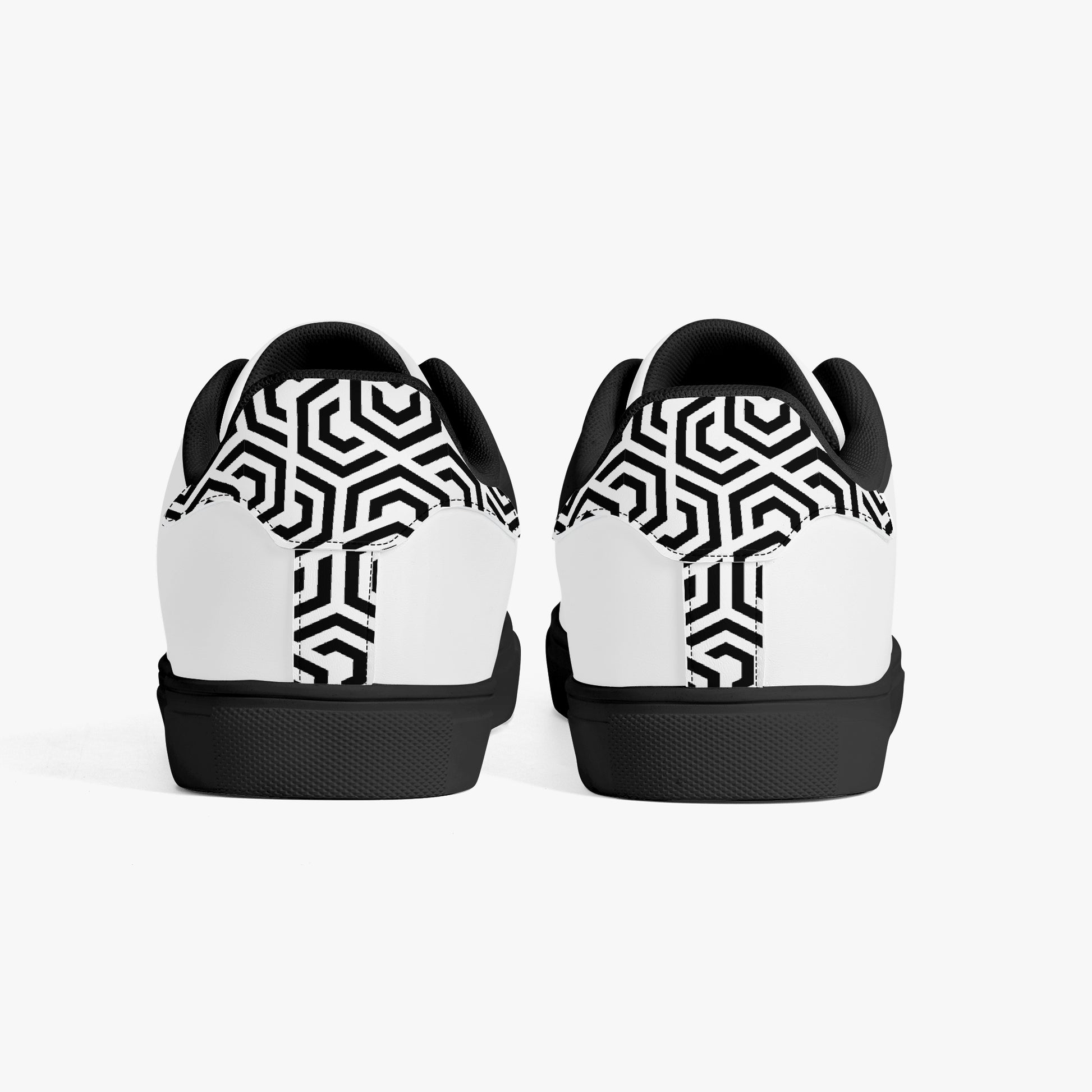 Black and white geometric patterned shoes on a white background