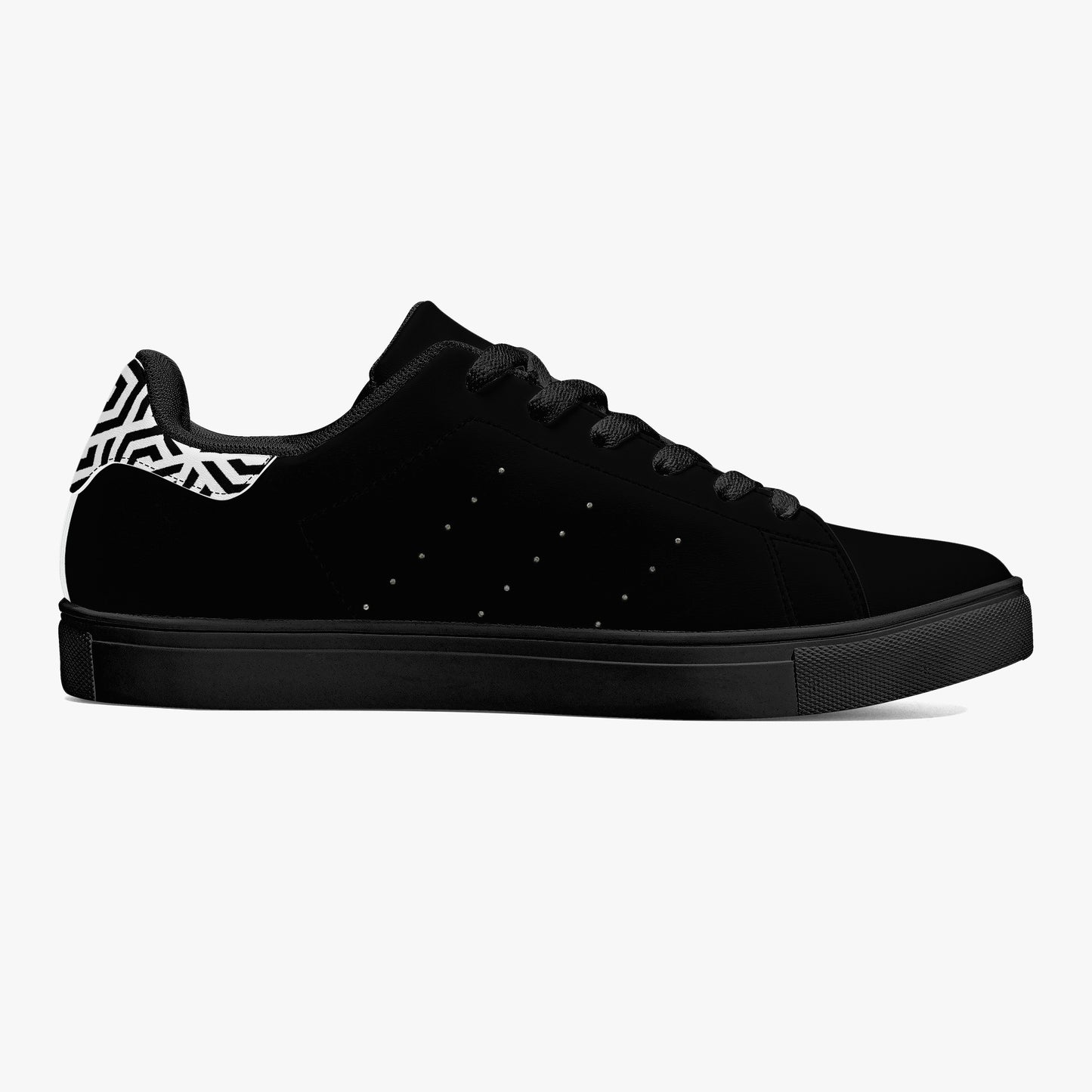 Black sneaker with zebra pattern heel on a white background