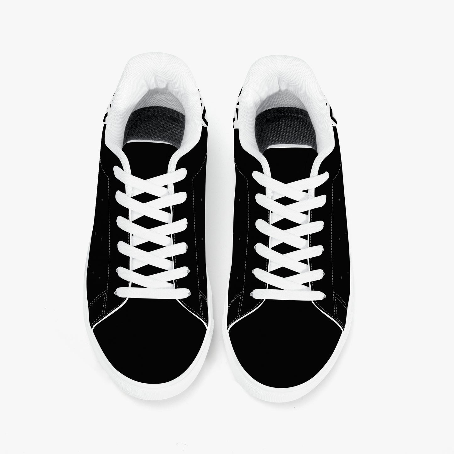 Black sneakers with white laces on a white background