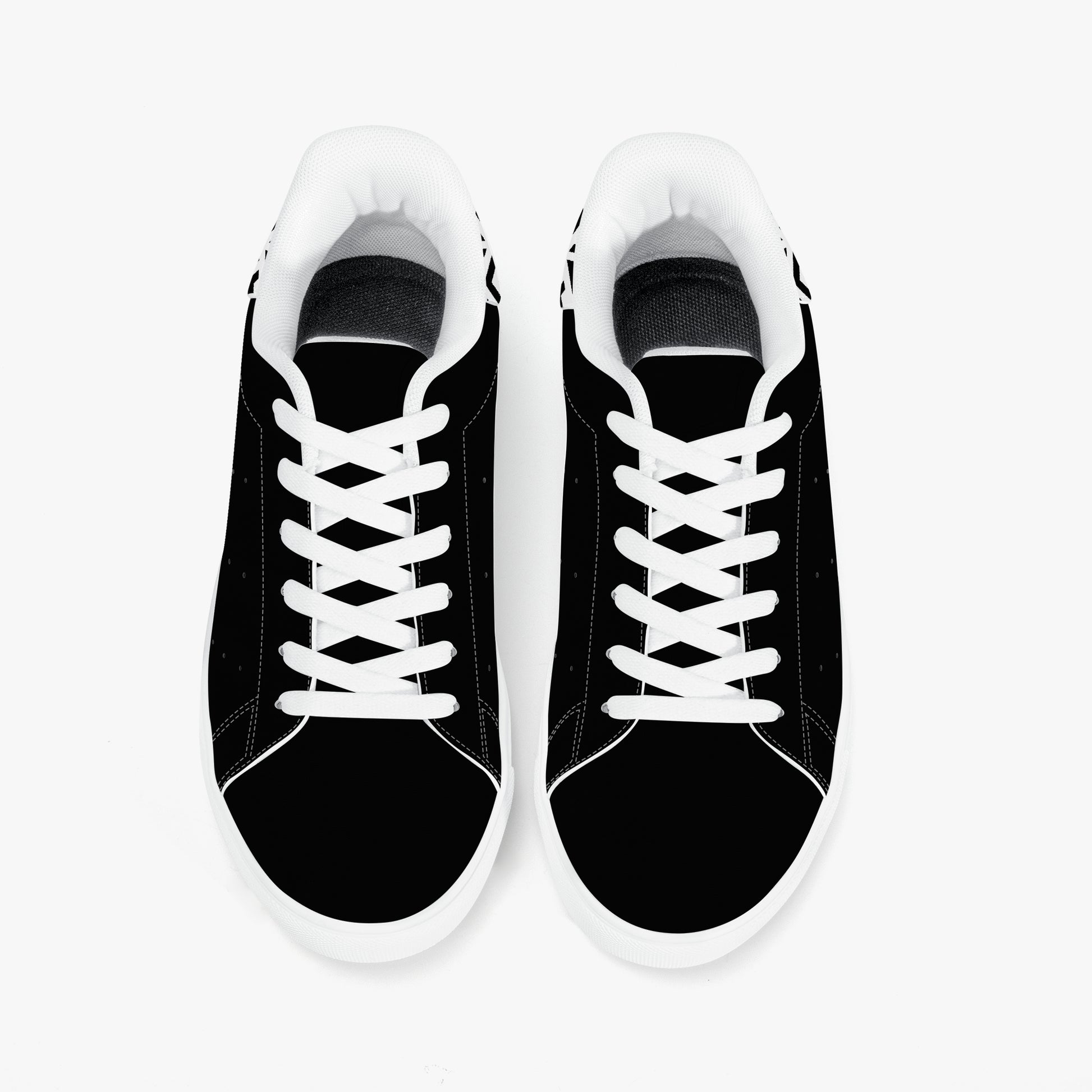 Black sneakers with white laces on a white background