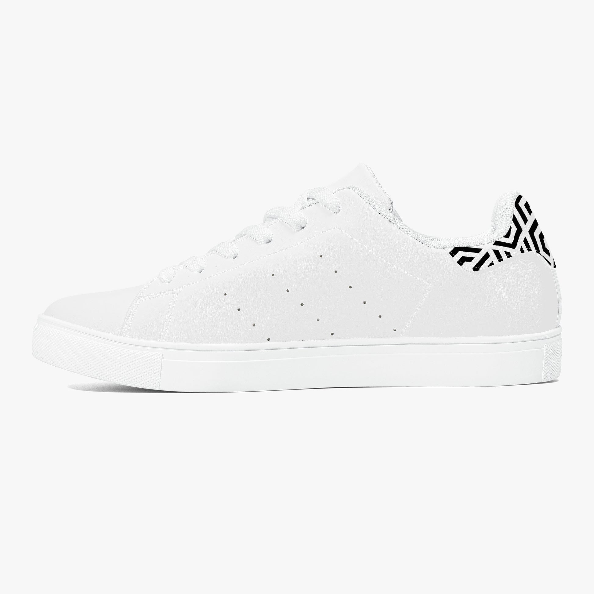 White sneaker with a black logo on a white background