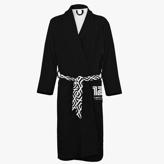 Black robe with a white patterned belt on a white background