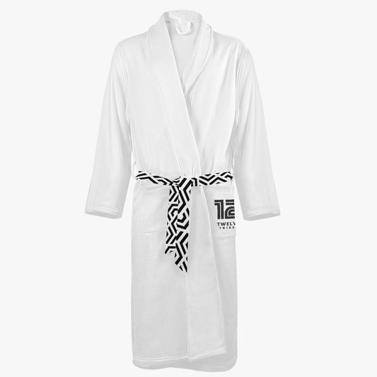 White robe with a patterned belt on a white background