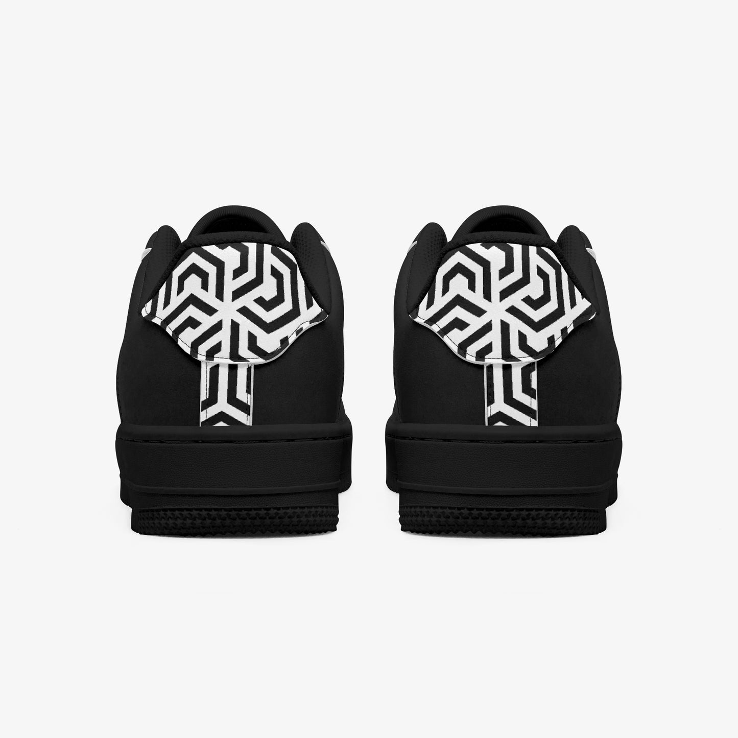 Black shoes with white geometric patterns on a white background
