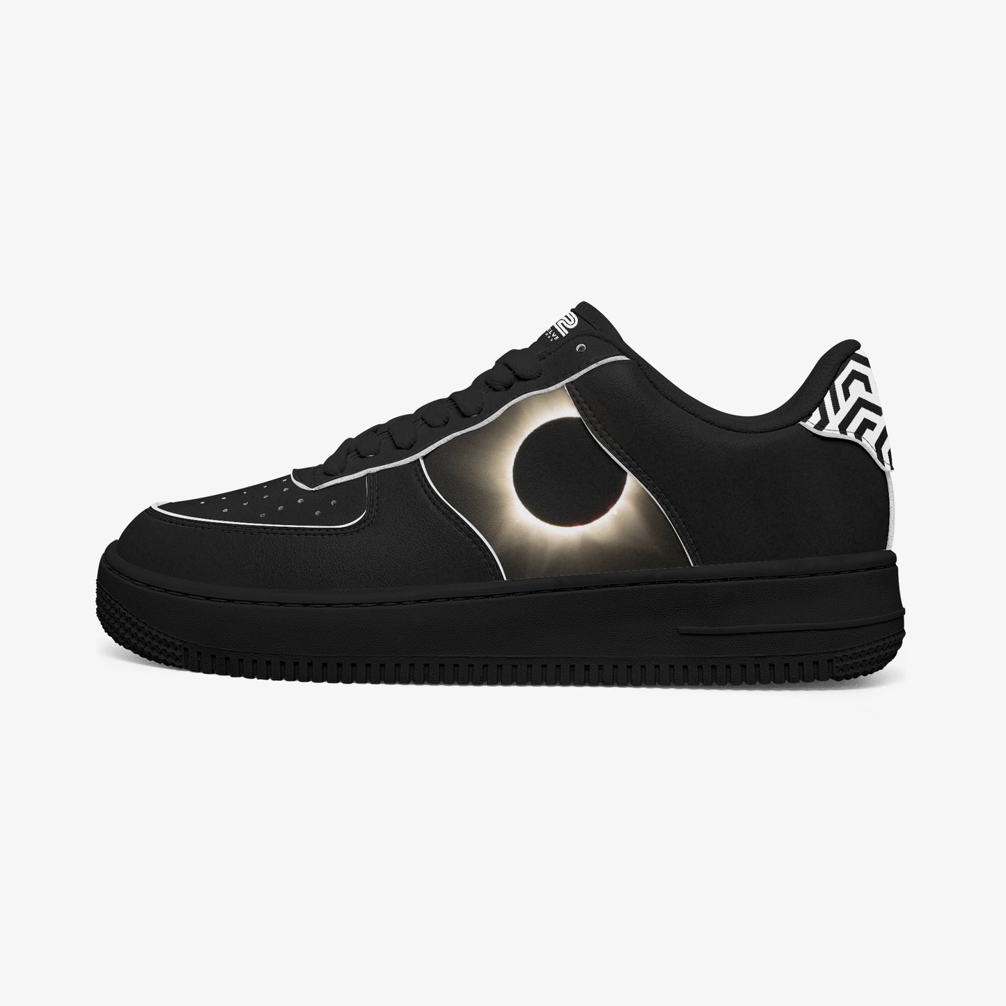 Black sneaker with solar eclipse design on a white background
