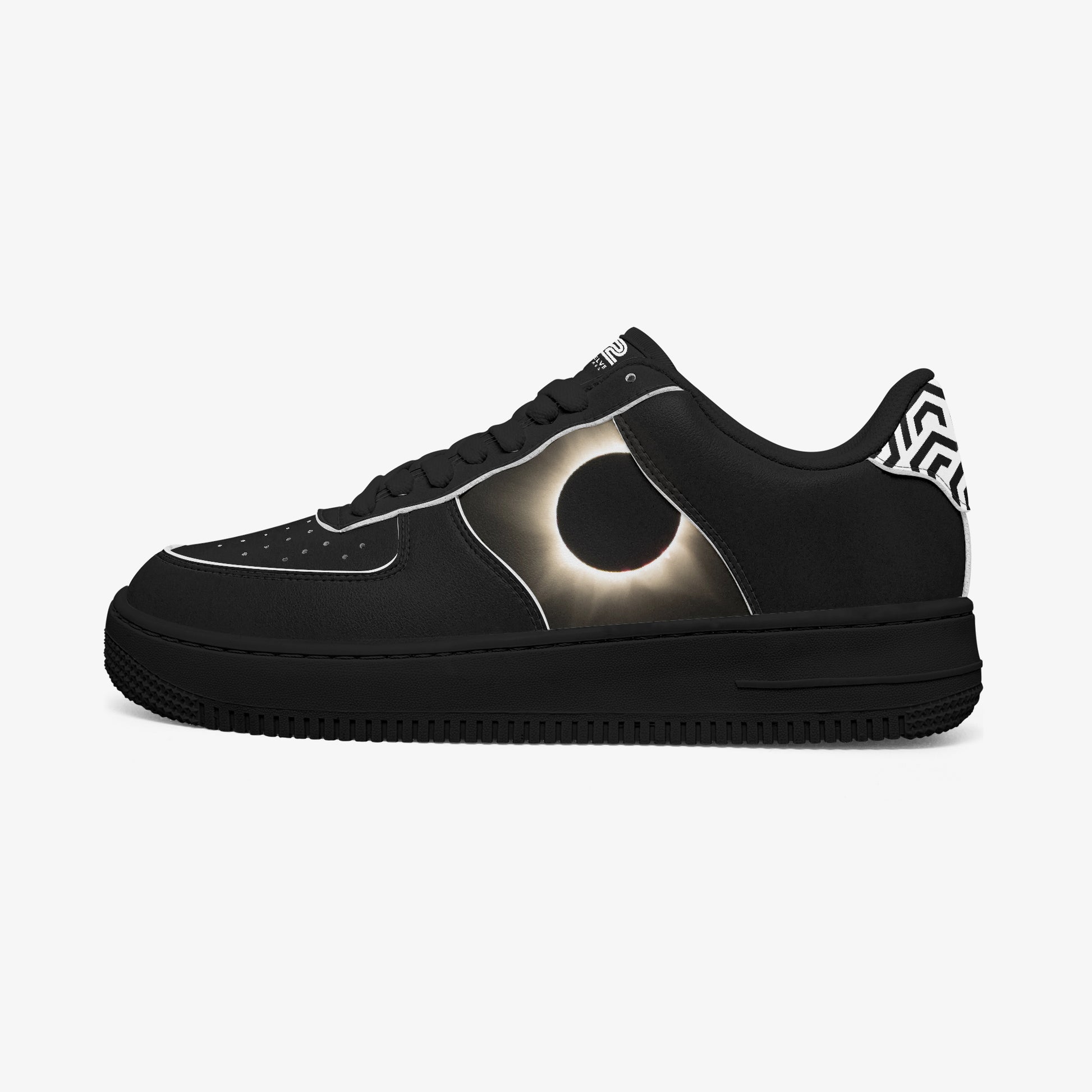 Black sneaker with solar eclipse design on a white background