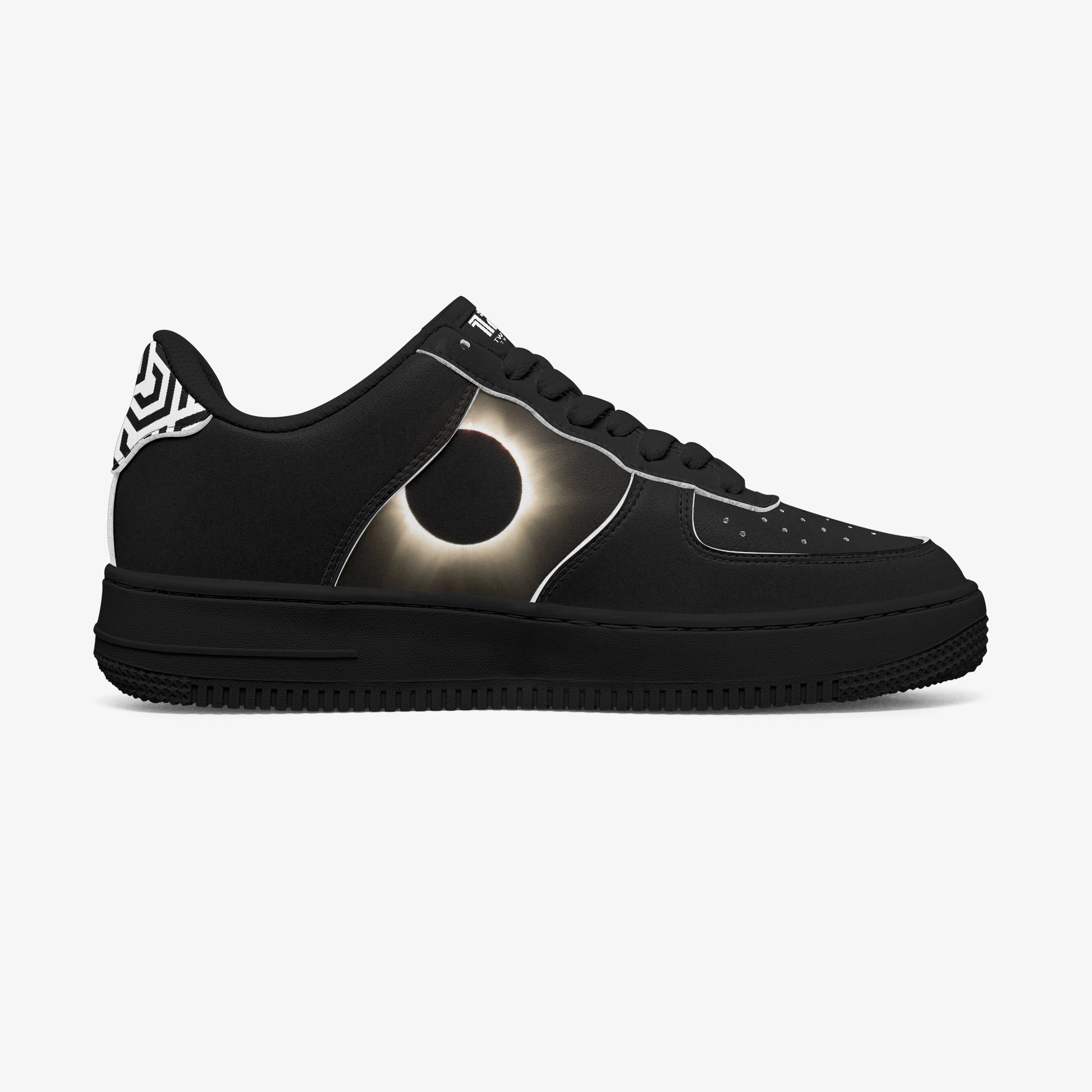 Black sneaker with a unique design on a white background