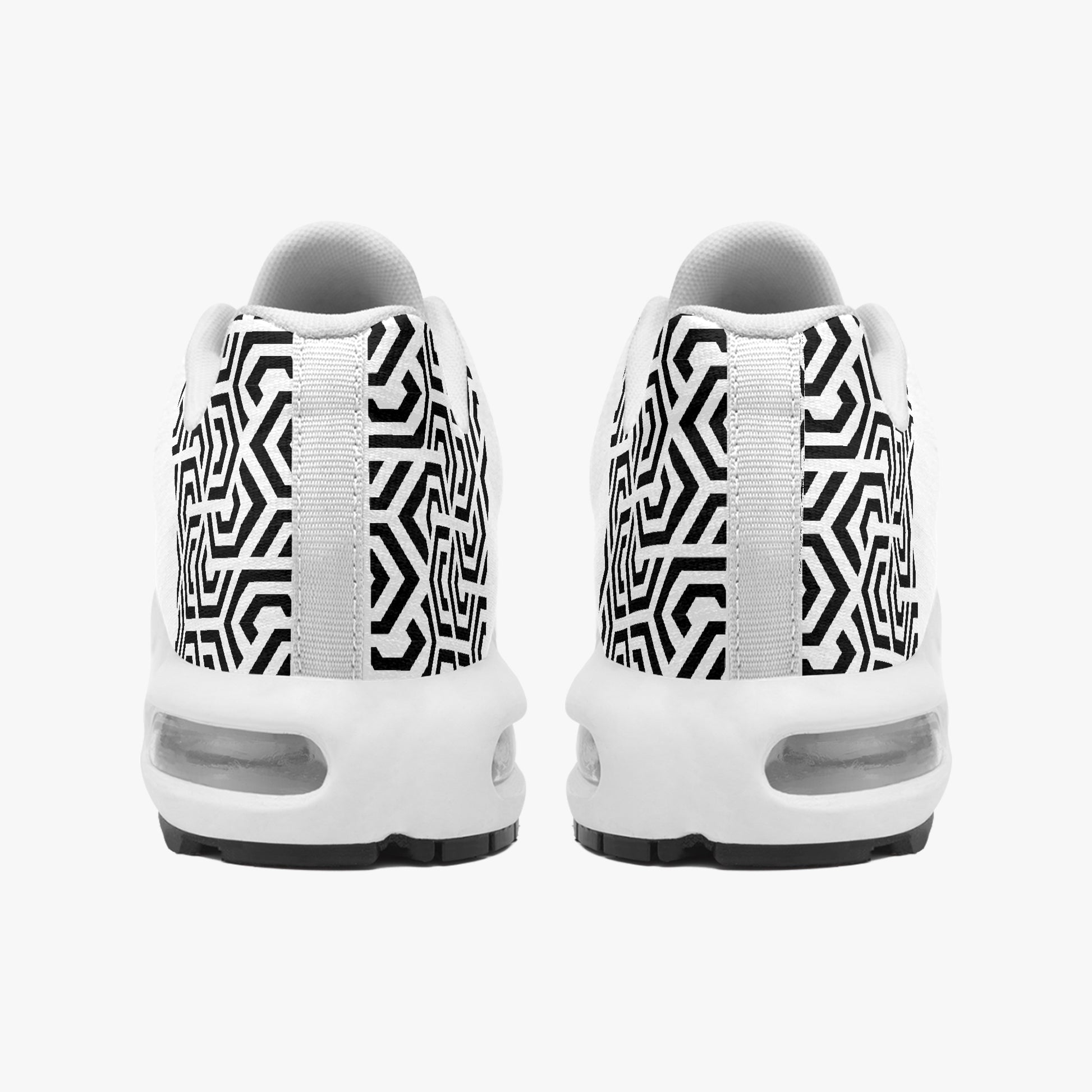 White sneakers with black geometric pattern on a white background