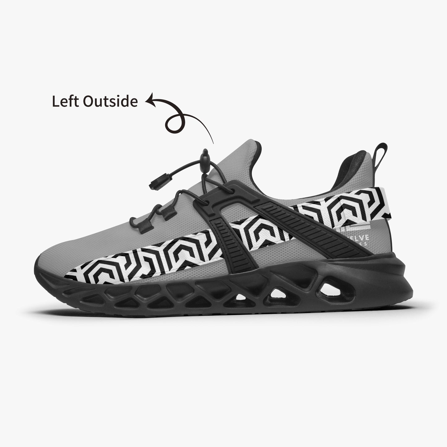 Black and gray sneaker with geometric pattern on a white background