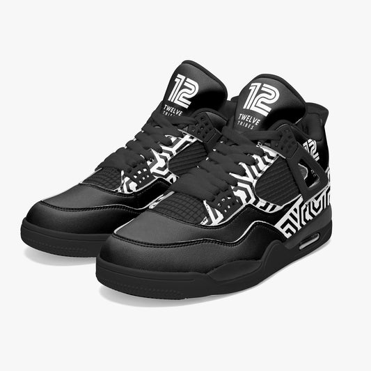 Black sneakers with white patterns and branding on a white background