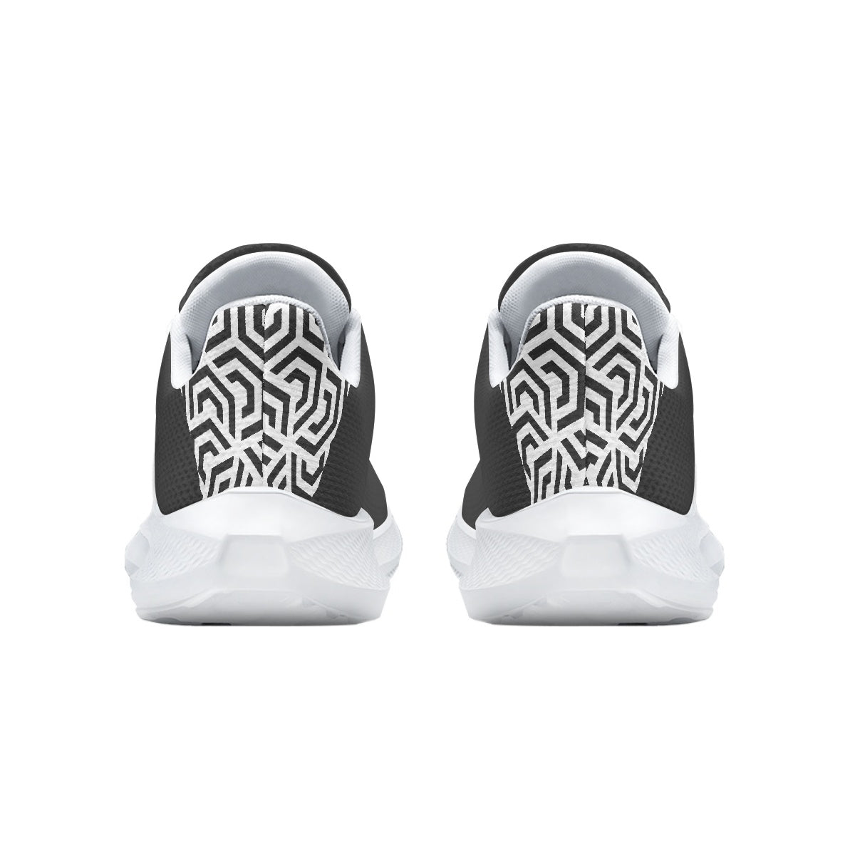 Black and white slip-on shoes with geometric pattern on a white background