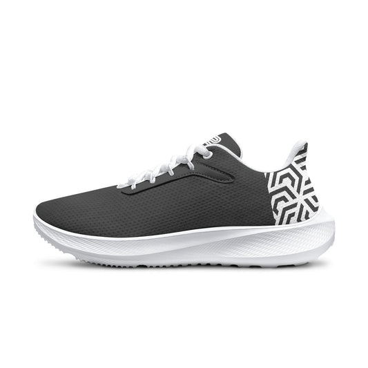 Black and white athletic shoe with geometric pattern on a white background