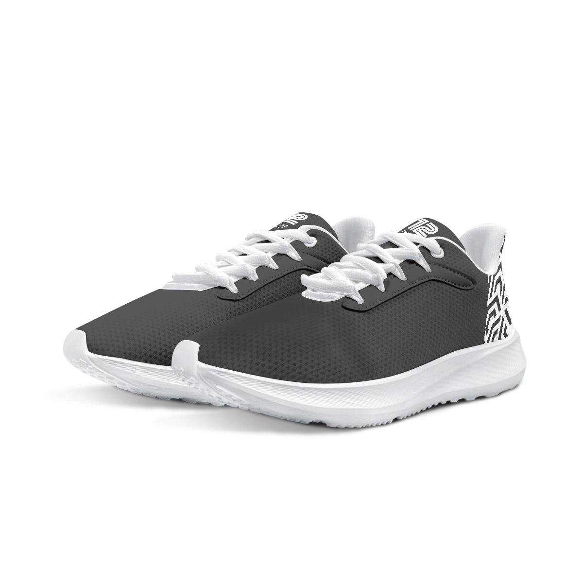 Pair of black and white athletic shoes on a white background
