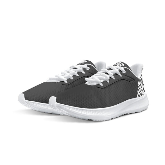 Pair of black and white athletic shoes on a white background