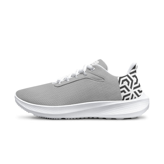 Gray athletic shoe with white sole on a white background
