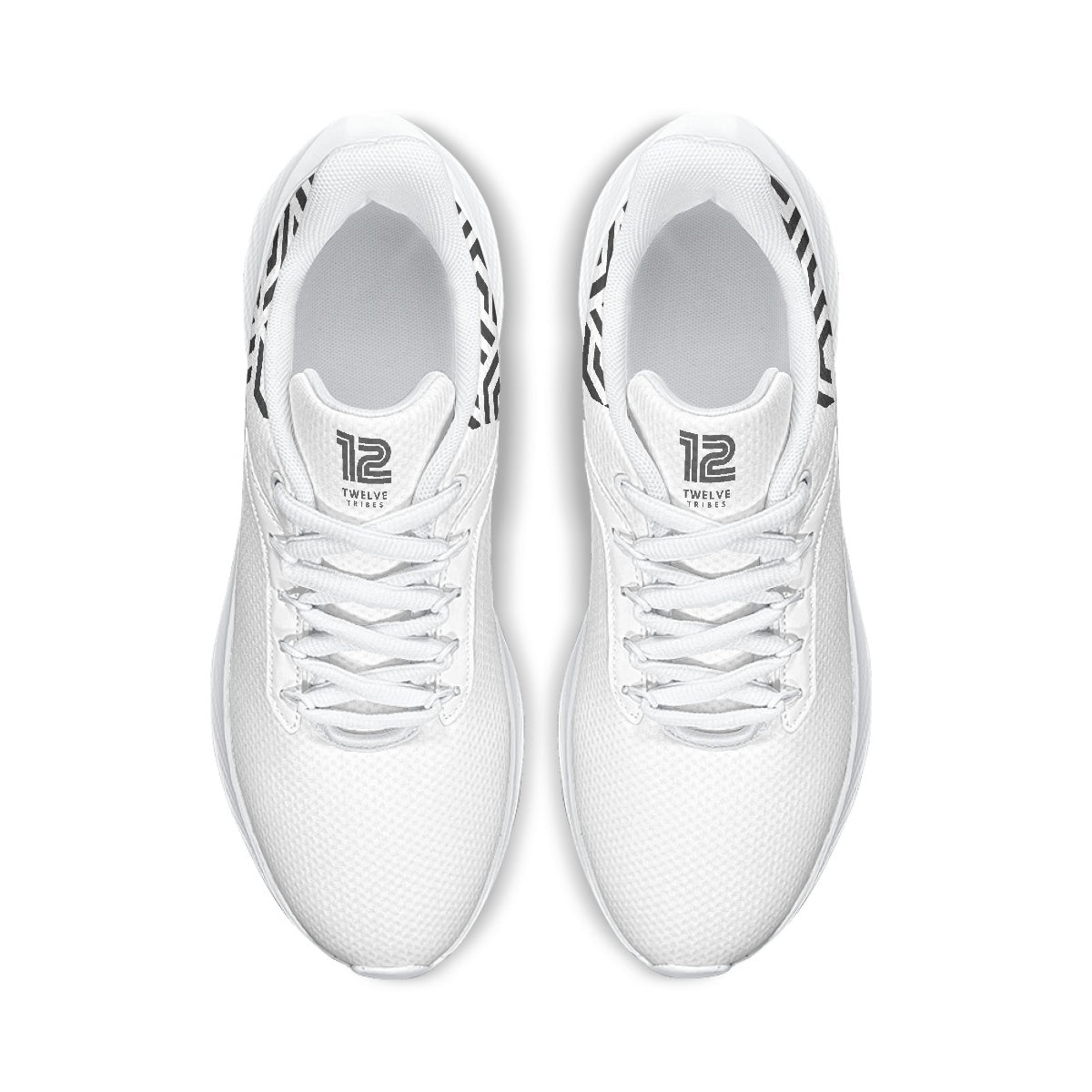 White sneakers with black branding on a white background