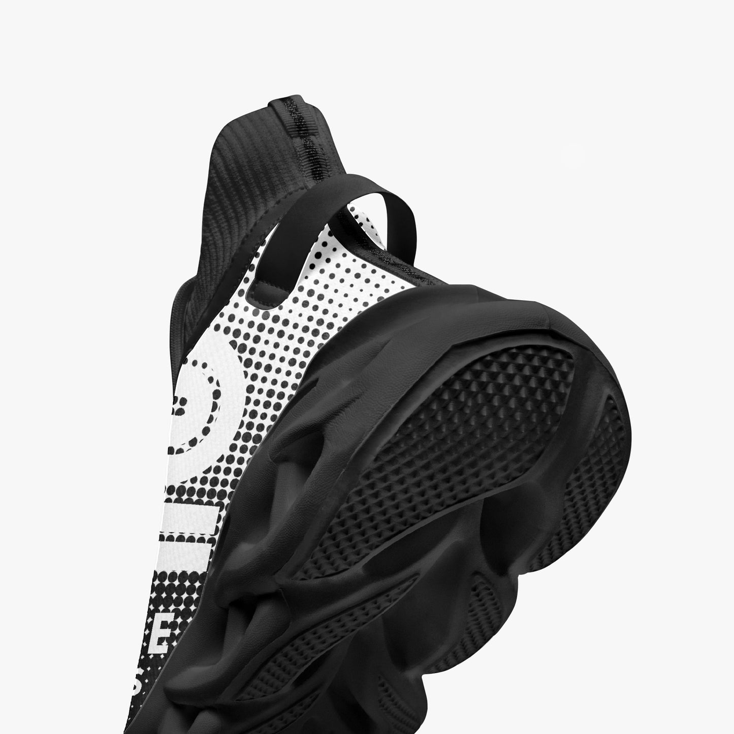 Black and white sneaker with a unique pattern on a light gray background