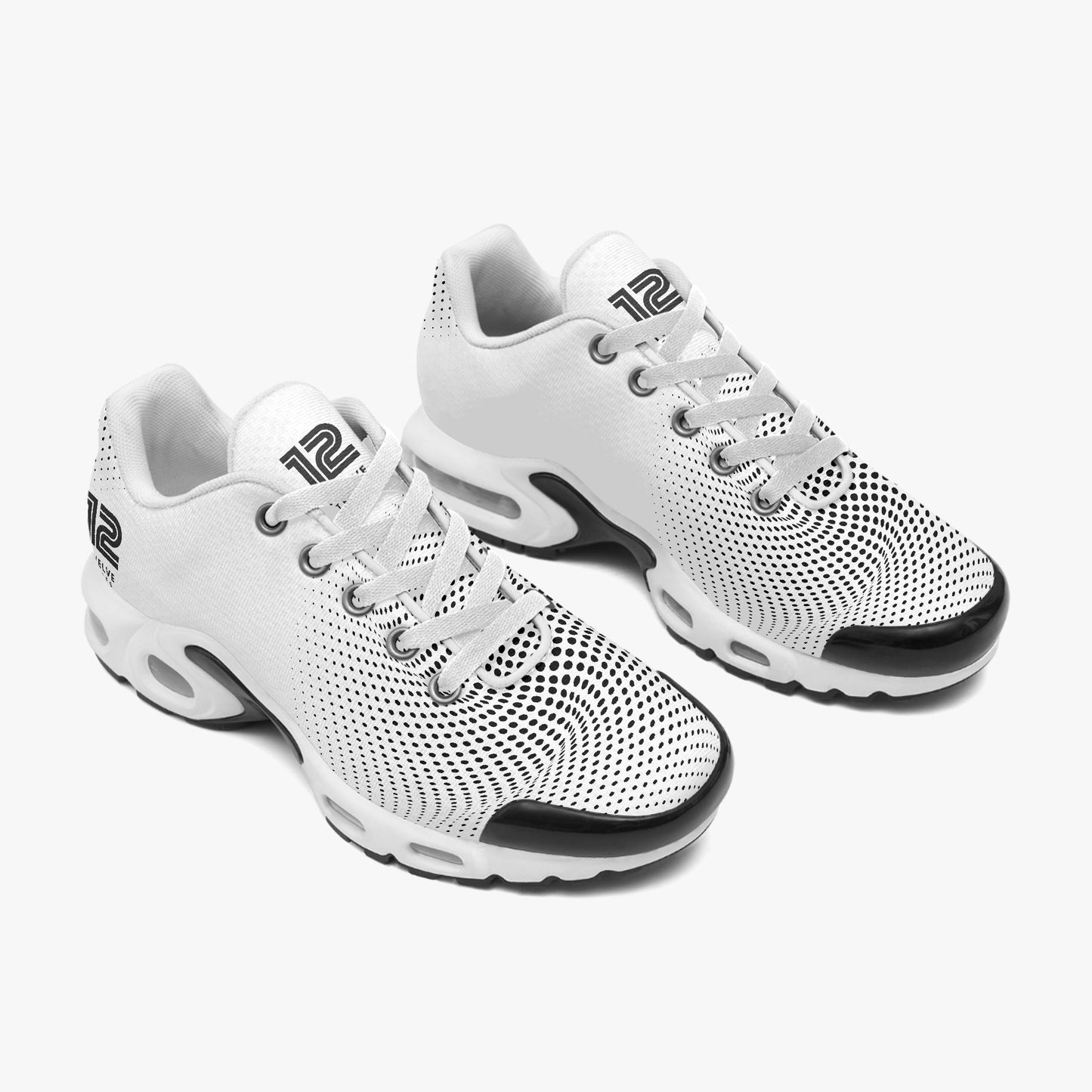 White sneakers with black soles on a white background
