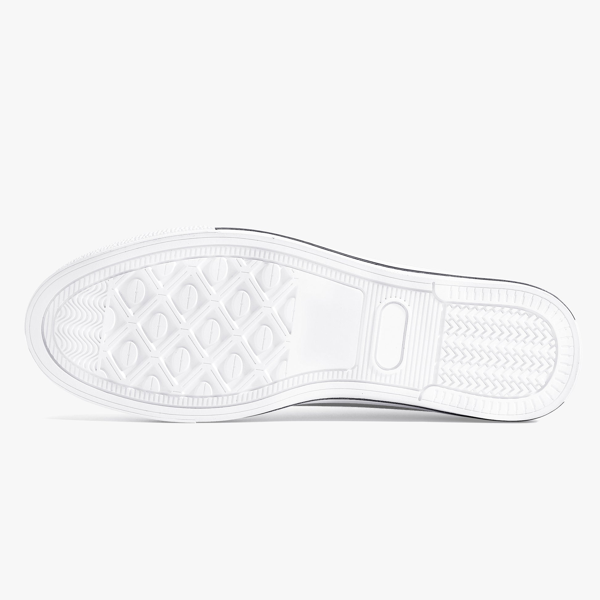 Close-up of a white sneaker sole with a textured pattern on a light gray background