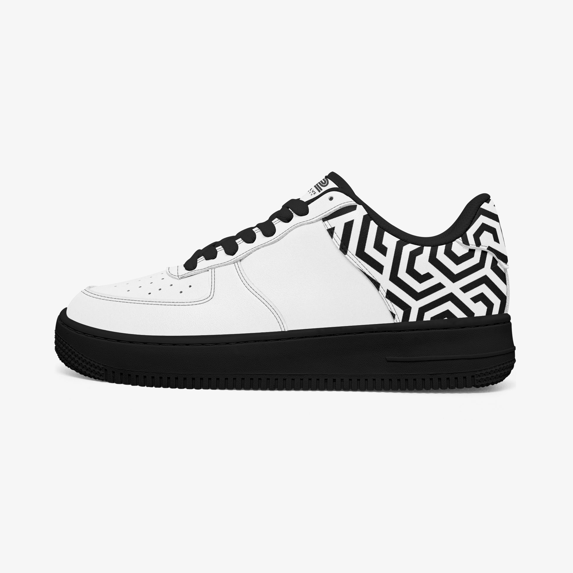 White sneaker with black geometric pattern on a white background