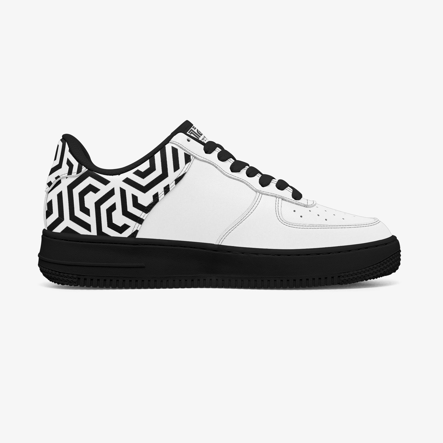 White sneaker with black and white geometric pattern on a white background