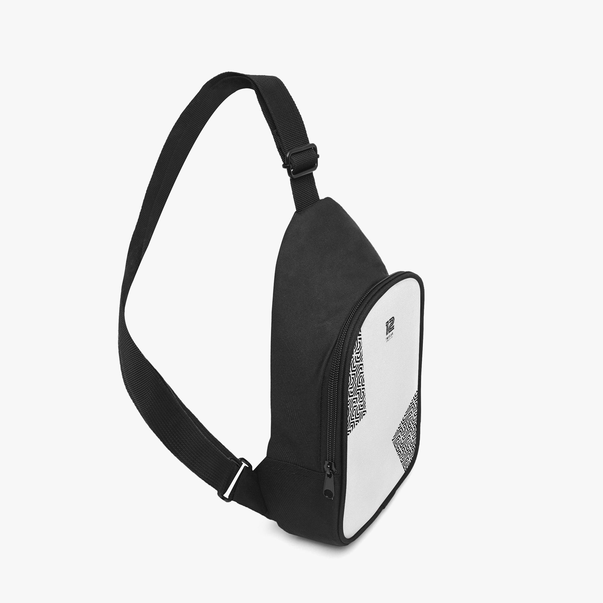 Black crossbody bag with a geometric pattern on a light gray background