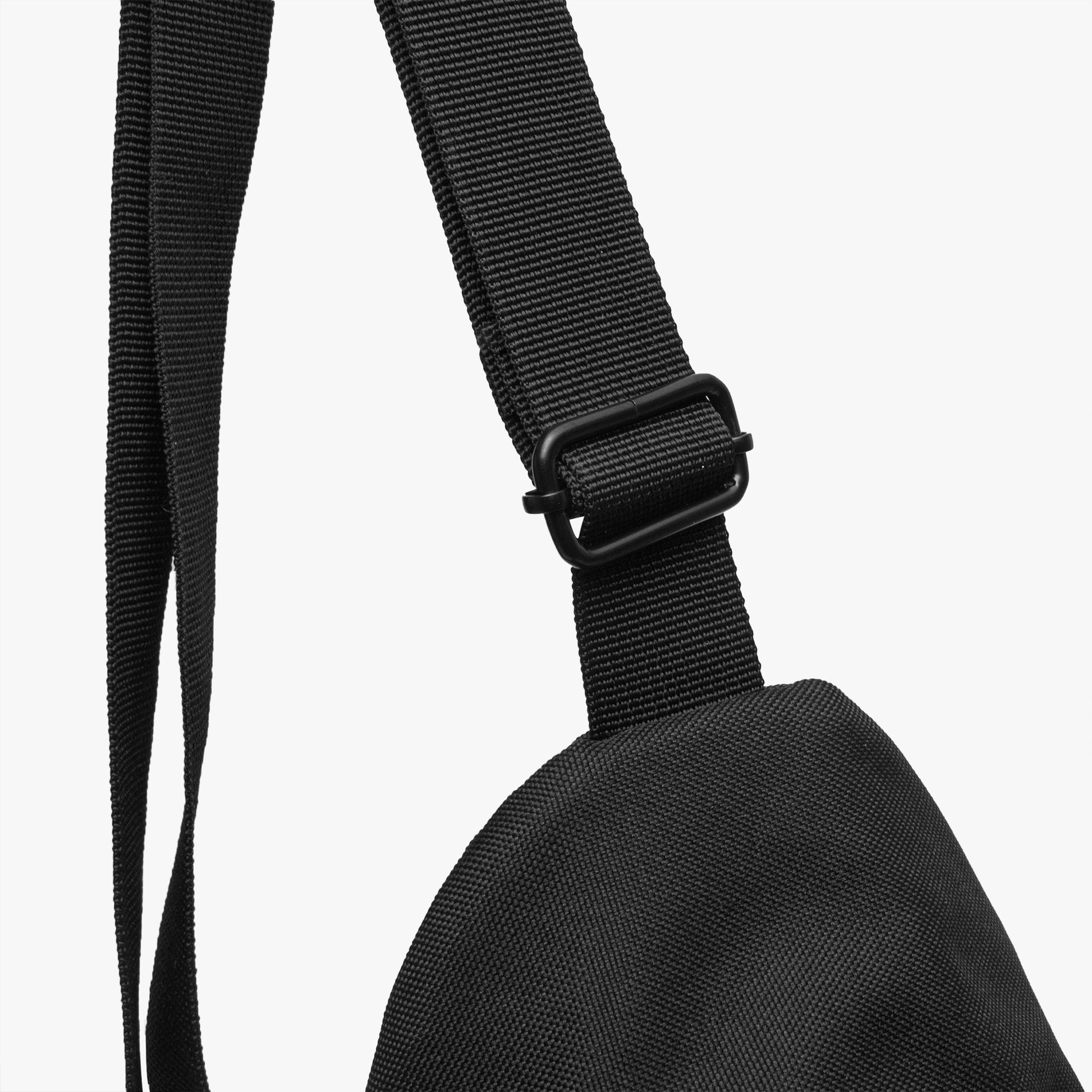 Black strap and bag corner on a white background