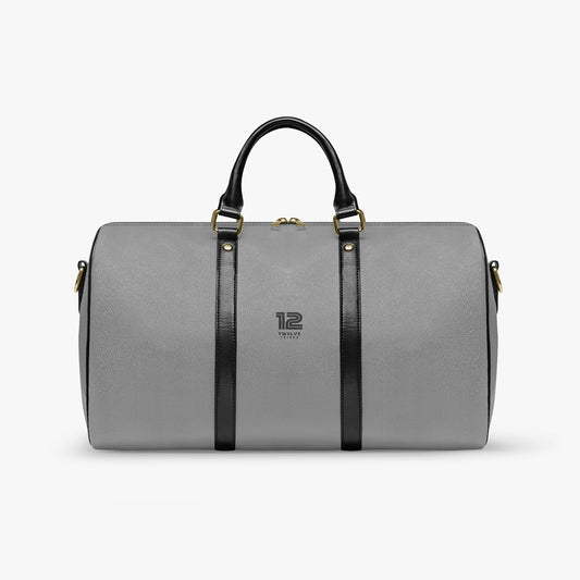 Gray duffel bag with black straps on a white background