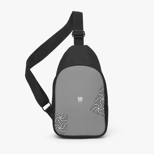 Gray sling bag with black strap on a white background